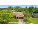 Single-story home with a pool and lush landscaping at 7504 Cypress Knee Dr, Hudson, FL 34667