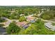 Aerial view showing house, pool, and large backyard at 7504 Cypress Knee Dr, Hudson, FL 34667