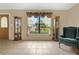 Spacious living room with large window, view of backyard, and comfortable seating at 7504 Cypress Knee Dr, Hudson, FL 34667