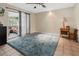 Gathering room with access to screened porch and large area rug at 7504 Cypress Knee Dr, Hudson, FL 34667