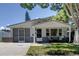 Charming single story home with gray accents and a covered porch at 6642 Stewart N Ave, St Petersburg, FL 33702