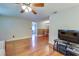 Hardwood floor living room with a view into the dining area at 6642 Stewart N Ave, St Petersburg, FL 33702