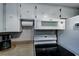 View of a kitchen with electric stove top, microwave, and coffee maker at 6642 Stewart N Ave, St Petersburg, FL 33702