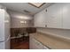 Kitchen with dining area, wood floors, and white cabinets at 6642 Stewart N Ave, St Petersburg, FL 33702