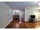 Dining area with glass table, four chairs, and hardwood floors at 6642 Stewart N Ave, St Petersburg, FL 33702