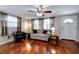 Living room featuring hardwood floors, a couch, and ceiling fan at 6642 Stewart N Ave, St Petersburg, FL 33702