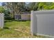 View of house with garage and screened porch from open gate at 6635 Stewart N Ave, St Petersburg, FL 33702