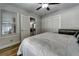 Well-lit bedroom with ceiling fan and view to sunroom at 6635 Stewart N Ave, St Petersburg, FL 33702
