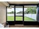 Screened porch overlooking backyard with fenced yard at 6635 Stewart N Ave, St Petersburg, FL 33702
