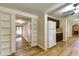 Hallway with built-in shelving and hardwood floors at 6635 Stewart N Ave, St Petersburg, FL 33702