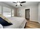 Bedroom with access to a sunroom and ceiling fan at 6635 Stewart N Ave, St Petersburg, FL 33702