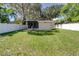 House with attached garage and screened porch, large backyard at 6635 Stewart N Ave, St Petersburg, FL 33702