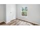 Simple bedroom with a closet and vinyl flooring at 14904 Old Dixie Hwy, Hudson, FL 34667