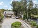 Aerial view of waterfront home with large yard and dock at 14904 Old Dixie Hwy, Hudson, FL 34667