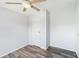 Simple bedroom with wood-look vinyl flooring and a closet at 14904 Old Dixie Hwy, Hudson, FL 34667