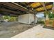 Unfinished basement with storage and outdoor access at 14904 Old Dixie Hwy, Hudson, FL 34667