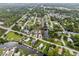 Aerial view of waterfront property situated in a quiet residential area at 14904 Old Dixie Hwy, Hudson, FL 34667