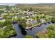 Wide aerial view showing the home's waterfront location in the community at 14904 Old Dixie Hwy, Hudson, FL 34667