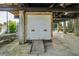 Unfinished basement with large white door and ramp at 14904 Old Dixie Hwy, Hudson, FL 34667