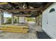 Under-house storage area with concrete floor and high ceilings, suitable for various uses at 14904 Old Dixie Hwy, Hudson, FL 34667