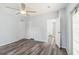 Primary bedroom with vinyl flooring and access to bathroom at 14904 Old Dixie Hwy, Hudson, FL 34667