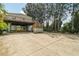Elevated home with large concrete parking area and wooden deck at 14904 Old Dixie Hwy, Hudson, FL 34667