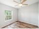 Bright bedroom featuring vinyl flooring and a window at 14904 Old Dixie Hwy, Hudson, FL 34667