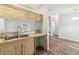 Kitchen with light wood cabinets and open layout at 14904 Old Dixie Hwy, Hudson, FL 34667