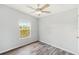 Spacious bedroom with vinyl flooring and a ceiling fan at 14904 Old Dixie Hwy, Hudson, FL 34667