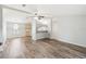 Open concept living and kitchen with vinyl flooring at 14904 Old Dixie Hwy, Hudson, FL 34667