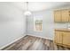 Bright dining area with light wood cabinets and vinyl flooring at 14904 Old Dixie Hwy, Hudson, FL 34667