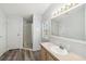 Bathroom with shower, vanity, and stained glass window at 14904 Old Dixie Hwy, Hudson, FL 34667