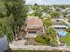 Aerial view of waterfront home with private dock and lush landscaping at 14904 Old Dixie Hwy, Hudson, FL 34667
