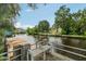 Wooden dock with metal benches, providing comfortable seating for enjoying the canal views at 14904 Old Dixie Hwy, Hudson, FL 34667