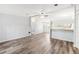 Open concept living area with vinyl flooring and kitchen view at 14904 Old Dixie Hwy, Hudson, FL 34667