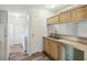 Kitchen with light wood cabinets and double sink at 14904 Old Dixie Hwy, Hudson, FL 34667