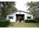 Metal barn with open garage doors and window at 23337 Lake Lindsey Rd, Brooksville, FL 34601