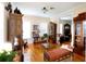Cozy living room with hardwood floors, antique furniture, and lots of natural light at 23337 Lake Lindsey Rd, Brooksville, FL 34601