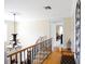 Stunning hallway with a chandelier, hardwood floors, and a beautiful staircase at 23337 Lake Lindsey Rd, Brooksville, FL 34601