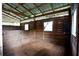 Spacious horse stable with wooden walls and flooring at 23337 Lake Lindsey Rd, Brooksville, FL 34601