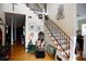 Grand entryway with hardwood floors and elegant staircase at 23337 Lake Lindsey Rd, Brooksville, FL 34601
