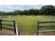 Large circular horse arena with wooden fencing at 23337 Lake Lindsey Rd, Brooksville, FL 34601