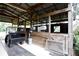 Rustic barn stalls with wood and wire dividers at 23337 Lake Lindsey Rd, Brooksville, FL 34601
