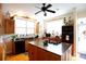 Spacious kitchen with granite island and wooden cabinets at 23337 Lake Lindsey Rd, Brooksville, FL 34601