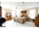 Main bedroom with king-size bed and ensuite bathroom access at 23337 Lake Lindsey Rd, Brooksville, FL 34601