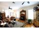 Living room with a fireplace, hardwood floors, and leopard print rug at 23337 Lake Lindsey Rd, Brooksville, FL 34601