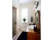 Bathroom with antique vanity, shower, and decorative accents at 23337 Lake Lindsey Rd, Brooksville, FL 34601