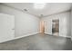 Bright bedroom with gray carpeting and an ensuite bathroom at 12113 Colony Lakes Blvd, New Port Richey, FL 34654