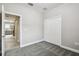 Bedroom with grey carpet and view into kitchen at 12113 Colony Lakes Blvd, New Port Richey, FL 34654