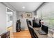 Spacious home office with wood floors and a view of the bathroom at 303 Old Mill Pond Rd # 303, Palm Harbor, FL 34683